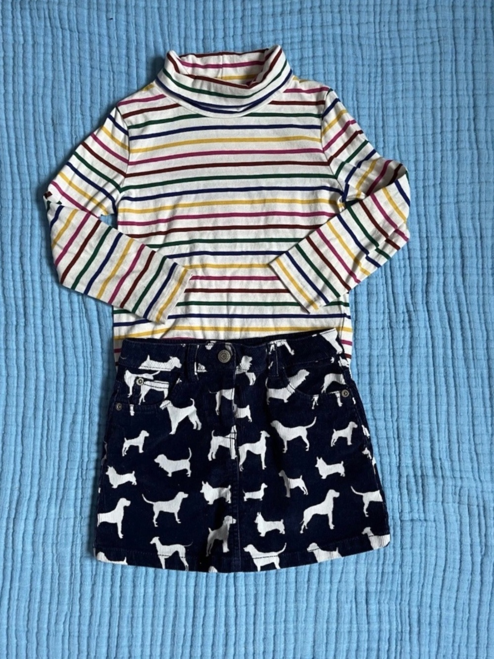 Mini Boden Rainbow stripe turtleneck & navy corduroy dog print skirt